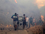 Эвакуированы 11 тысяч человек, сгорели более 2500 домов. 15 человек погибли