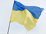 Неизвестные люди, напавшие на Меджлис в Крыму, сняли украинский флаг и избили несколько женщин