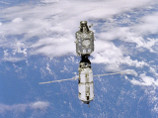 Трое космонавтов, обеспечивших вынос в открытый космос олимпийского факела, вернулись на Землю
