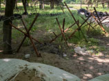 В военной части под Луганском мятежники при помощи гранатомета уничтожили склад боеприпасов