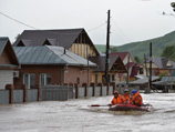 Число жертв наводнения в Сибири увеличивается. Пострадавшим выделены миллионы на компенсации