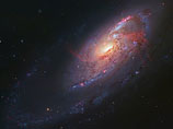 В NASA опубликовали фото космического "фейерверка" - изменений, происходящих с галактикой под влиянием черной дыры