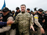 Президент Украины Петр Порошенко посетил Славянск, который заняли украинские военные, и заявил, что в скором времени планирует оказаться в Донецке и Луганске