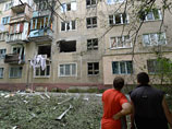 Жилой многоквартирный дом на окраине Донецка, пострадавший от артиллерийского обстрела. Украина, 20 июля 2014 года