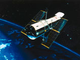 Телескоп Hubble нашел во Вселенной самую далекую галактику-линзу Телескоп Hubble нашел во Вселенной самую далекую галактику-линзу