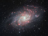 Ученые сделали впечатляющие снимки красных облаков газа в Галактике Треугольника (ФОТО)