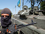 Украинские силовики утверждают, что подняли флаг над отделом милиции одного из районов Луганска
