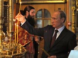 Путин в московском храме почтил память "тех, кто пострадал, защищая людей в Новороссии"