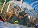 Активисты Occupy Central в Гонконге разблокировали правительственный комплекс и пустили чиновников на работу Активисты Occupy Central в Гонконге разблокировали правительственный комплекс и пустили чиновников на работу