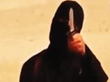 Боевики из экстремистской группировки "Исламское государство" (ИГ) распространили в воскресенье в видео, на котором запечатлена казнь американца Питера Кэссига