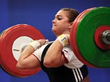 Российская спортсменка Татьяна Каширина стала обладательницей золотой медали чемпионата мира по тяжелой атлетике, который проходит в Алма-Ате, обновив при этом мировые рекорды в рывке и толчке, а также по сумме двух упражнений