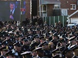 В Нью-Йорке проститься с убитым из мести полицейским пришли десятки тысяч человек В Нью-Йорке проститься с убитым из мести полицейским пришли десятки тысяч человек