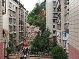 На юго-западе Китая обрушился 9-этажный жилой дом, под завалами могут находиться люди