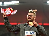 Чемпион мира в метании молота расплатился с таксистом золотой медалью Чемпион мира в метании молота расплатился с таксистом золотой медалью