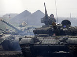 На Донбассе украинские власти заключили с сепаратистами соглашение об отводе вооружений калибром меньше 100 мм от линии соприкосновения - это танки и артиллерия