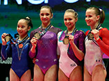 На чемпионате мира сразу четыре гимнастки получили золотые медали за выступления на брусьях