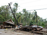 Тайфун обрушился на страну с Тихого океана, спровоцировав сильные наводнения на центральных островах и обрушив проливные дожди на столицу - Манилу