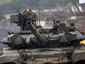"Их нетрудно узнать, - заявил французской газете боец "Северного полка" Айман Дахеш. - Они белокожие, носят другую форму и управляют танками "Т-90" - гораздо более современными, чем "Т-55" или "Т-72", обычно используемыми сирийской армией"