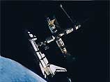 Семь членов экипажа корабля Atlantis, в том числе двое российских космонавтов Юрий Маленченко и Борис Моруков, пробыли на Международной станции 8 суток
