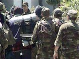 Около 10:15 по тбилисскому времени 13 задержанных, в основном жителей Кабардино-Балкарии, были доставлены под конвоем спецназа министерства юстиции Грузии в аэропорт Тбилиси