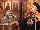 Патриарх Иерусалимской Православной Церкви Ириней у пустого кресла Ясира Арафата в базилике Рождества в Вифлееме