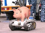 Внешне робот напоминает большую металлическую коробку, оснащенную гусеницами Внешне робот напоминает большую металлическую коробку, оснащенную гусеницами