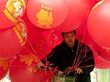 Народными гуляньями, торжественным семейным застольем и красочными фейерверками готовятся встретить жители Китая "Цчун Цзе"