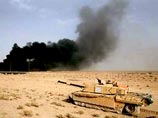 В результате обстрела британскими танками иракского продовольственного склада в Басре в пятницу сгорела автомашина съемочной группы катарского телеканала Al-Jazeera