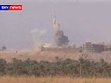 Иракское телевидение показала кадры налет американского вертолета, обстрелявшего ракетами кондитерскую фабрику в городе Эн-Наджаф, а также жилые дома