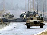 Американские танки и бронетранспортеры в понедельник утром начали штурм иракской столицы