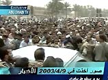 Телевидение Абу-Даби показало демонстрацию в Багдаде с участием Хусейна и его сына Кусая