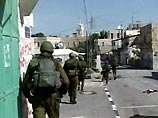 Израильские солдаты заняли во вторник утром центральную часть города Наблус на Западном берегу реки Иордан