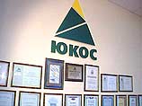 Акционеры НК ЮКОС готовы отказаться от высших руководящих постов в объединенной компании, чтобы спасти сделку по слиянию с "Сибнефтью"