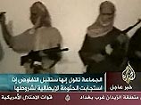 Al-Jazeera показала видеозапись с захваченными в Ираке 4 итальянцами (ФОТО) Al-Jazeera показала видеозапись с захваченными в Ираке 4 итальянцами (ФОТО)