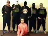 11 мая связанный с "Аль-Каидой" интернет-сайт опубликовал видеозапись, на которой пятеро человек в масках присутствуют на казни Берга