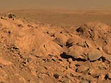 Как сообщили в среду ученые из лаборатории NASA в Пасадене, на склонах холмов Spirit удалось обнаружить выход первичной скалы - коренной породы, не прикрытой выбросами лавы