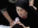 На городском кладбище Беслана в воскресенье были похоронены 18 погибших во время теракта в школе номер 1. Из них шесть человек моложе 16 лет На городском кладбище Беслана в воскресенье были похоронены 18 погибших во время теракта в школе номер 1. Из них шесть человек моложе 16 лет