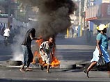 На Гаити готовится очередной переворот: повстанцы жгут машины в центре города