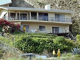 Более 20 домов пострадали в результате сильного оползня, который произошел в местечке Лагуна Бич на тихоокеанском побережье в 60 км к югу от Лос-Анджелеса