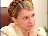 Тимошенко не собирается отменять поездку в Россию, но пока не определилась с датой визита