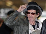 Гитарист Rolling Stones госпитализирован после падения с пальмы
