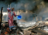 В категории "мировые новости" лучшим стал африканский фотокорреспондент Reuters, которому удалось сфотографировать человека, который вытирал копоть со своего лица после взрыва нефтепровода в Нигерии в минувшем декабре