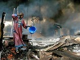 В категории "мировые новости" лучшим стал африканский фотокорреспондент Reuters, которому удалось сфотографировать человека, который вытирал копоть со своего лица после взрыва нефтепровода в Нигерии