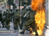 Очередную годовщину переворота 1973 года в Чили отметили уличными боями Очередную годовщину переворота 1973 года в Чили отметили уличными боями
