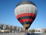Воздушный шар "завис над центральной площадью города", рассказал сотрудник пресс-службы Кемеровской епархии Евгений Кобяков