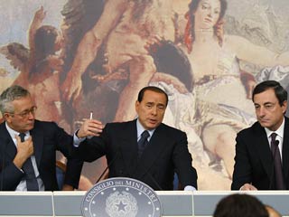 "Идея остановки рынков на время, необходимое для переписки правил, обсуждается", - сказал Сильвио Берлускони после завершения заседания кабинета министров Италии