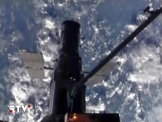 Астронавты космического корабля Atlantis успешно завершили второй из пяти намеченных на нынешний полет выходов в открытый космос