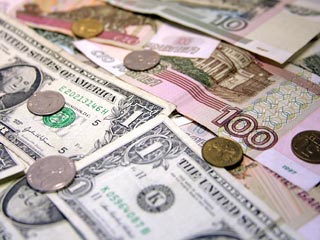 Доллар вырос к рублю впервые за 6 торговых дней, поднявшись на 9 копеек 