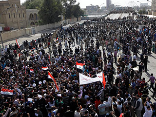 Волна протестов охватила в пятницу Ирак - там прошел первый общенациональный "День гнева"