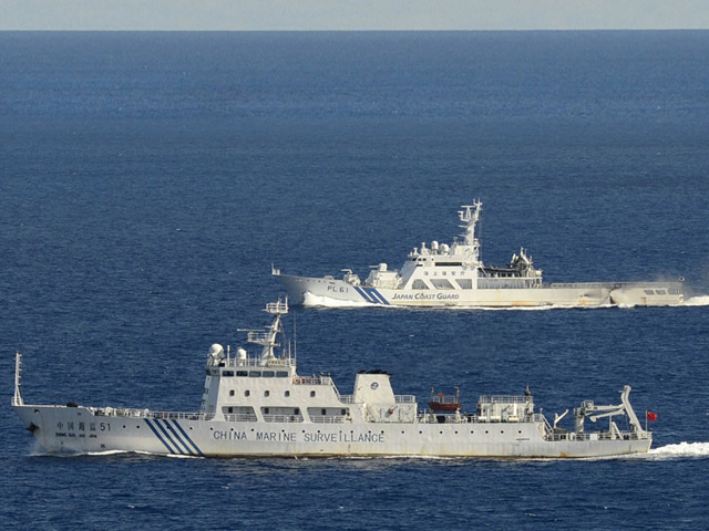 Китайские патрульные корабли совершили в пятницу самый массированный в истории демонстративный заход в зону, которую Япония считает своими территориальными водами у спорных островов Сенкаку (Дяоюйдао)